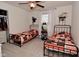 Bright bedroom featuring dual beds, ample natural light, and ceiling fan, ideal for sharing at 655 Bracknell Dr, Avon, IN 46123
