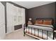 Cozy bedroom featuring a dark accent wall, natural light, and contemporary furniture at 655 Bracknell Dr, Avon, IN 46123