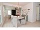 Inviting dining area next to the living room with large doorway and stylish light fixture at 655 Bracknell Dr, Avon, IN 46123