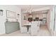 Bright dining area adjacent to the kitchen with a modern chandelier and side buffet at 655 Bracknell Dr, Avon, IN 46123