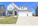Charming two-story home with stone accents and a spacious three car garage in a suburban neighborhood at 655 Bracknell Dr, Avon, IN 46123