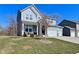 Charming two-story home with a manicured lawn, stone accents, and a three car garage at 655 Bracknell Dr, Avon, IN 46123