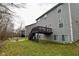 Exterior view of a home with a deck overlooking the landscaped backyard at 655 Bracknell Dr, Avon, IN 46123
