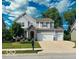 Charming two-story home with stone accents, well-maintained lawn, and a spacious two car attached garage at 655 Bracknell Dr, Avon, IN 46123