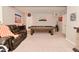 Game room featuring a pool table, comfortable seating, and a cozy fireplace, creating a perfect recreational space at 655 Bracknell Dr, Avon, IN 46123
