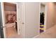 Hallway view showcasing doorways to a bathroom and a playroom or bonus room, creating seamless transitions at 655 Bracknell Dr, Avon, IN 46123