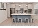 Stylish kitchen featuring a large island, stainless steel appliances, and a tile backsplash at 655 Bracknell Dr, Avon, IN 46123