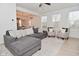 Cozy living room featuring a plush gray sectional, neutral armchairs, and natural light at 655 Bracknell Dr, Avon, IN 46123