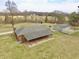 Spacious single-story brick home and detached garage with basketball court on a sprawling lawn at 6900 W Georgetown Rd, Columbus, IN 47201
