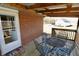View of the outdoor back deck with a table and chairs at 6900 W Georgetown Rd, Columbus, IN 47201