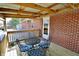 View of the outdoor back deck with a table and chairs at 6900 W Georgetown Rd, Columbus, IN 47201