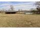 Expansive backyard with detached garage, mature trees and plenty of open space for recreation at 6900 W Georgetown Rd, Columbus, IN 47201