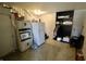 An interior shot of the basement features a refrigerator, microwave, and storage at 6900 W Georgetown Rd, Columbus, IN 47201