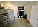An interior shot of the basement features a refrigerator, microwave, and storage at 6900 W Georgetown Rd, Columbus, IN 47201