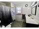 The bathroom features a shower with a white and blue patterned curtain and sink at 6900 W Georgetown Rd, Columbus, IN 47201