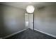 Cozy gray bedroom with plush carpet and plenty of natural light from open door at 6900 W Georgetown Rd, Columbus, IN 47201