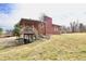 Brick home with basement access, covered deck, and large yard at 6900 W Georgetown Rd, Columbus, IN 47201