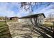 Exterior view of vinyl siding, concrete patio, French doors and a fenced-in area at 6900 W Georgetown Rd, Columbus, IN 47201
