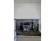 Interior shot showing a black brick fireplace with a black wood burning stove at 6900 W Georgetown Rd, Columbus, IN 47201