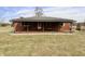 Inviting brick home featuring a spacious front porch, perfect for enjoying the outdoors at 6900 W Georgetown Rd, Columbus, IN 47201