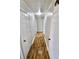 Hallway with wood floors and white walls at 6900 W Georgetown Rd, Columbus, IN 47201