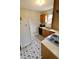 Efficient kitchen with appliances and stylish gray and white geometric-patterned flooring at 6900 W Georgetown Rd, Columbus, IN 47201