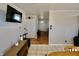 Open living area with tiled floor, neutral paint, and access to the kitchen at 6900 W Georgetown Rd, Columbus, IN 47201