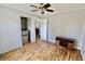 Inviting living room with wood floors and door to a bedroom at 6900 W Georgetown Rd, Columbus, IN 47201