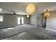 Spacious living room with contemporary lighting, carpet and access to the yard at 6900 W Georgetown Rd, Columbus, IN 47201