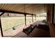 Relax on this inviting covered porch, complete with a cozy swing and wooded views at 6900 W Georgetown Rd, Columbus, IN 47201