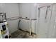 Unfinished utility room with modern glass shower door and exposed plumbing at 6900 W Georgetown Rd, Columbus, IN 47201