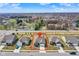 An aerial view of a neighborhood featuring houses with large yards, trees, and a serene pond at 7326 Wooden Grange Dr, Indianapolis, IN 46259