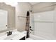 Bathroom featuring a white vanity, bathtub, and shower with brown curtains at 7326 Wooden Grange Dr, Indianapolis, IN 46259