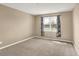 Neutral bedroom featuring a large window and curtains at 7326 Wooden Grange Dr, Indianapolis, IN 46259
