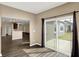 Bright living room with wood floors and sliding glass door leading to outdoor space at 7326 Wooden Grange Dr, Indianapolis, IN 46259