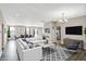 Open living room with neutral walls, modern furniture, decorative lighting, and an inviting atmosphere at 7326 Wooden Grange Dr, Indianapolis, IN 46259