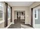 Bright sunroom featuring windows, sliding doors, wood floors, recessed lighting, and stylish window coverings at 7326 Wooden Grange Dr, Indianapolis, IN 46259