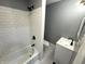 This bathroom features white subway tile, neutral walls, and new vanity at 745 W 25Th St, Indianapolis, IN 46208