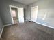Bedroom with closet, new carpet, and doorway to additional rooms at 745 W 25Th St, Indianapolis, IN 46208