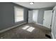 A large bedroom with neutral walls, white doors, and carpet at 745 W 25Th St, Indianapolis, IN 46208