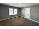Bedroom features carpeting, neutral paint, and natural light at 745 W 25Th St, Indianapolis, IN 46208