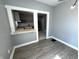 Open dining room view to kitchen, featuring hardwood floors and neutral grey paint at 745 W 25Th St, Indianapolis, IN 46208