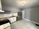 A view of kitchen with stainless steel appliances, open shelving, and white tile backsplash at 745 W 25Th St, Indianapolis, IN 46208