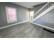 Living room with new flooring and natural light from the window at 745 W 25Th St, Indianapolis, IN 46208