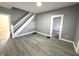 Open living room with sleek gray walls, staircase, and modern floors at 745 W 25Th St, Indianapolis, IN 46208