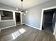 Open-concept living room flows into the kitchen, with modern lighting and flooring at 745 W 25Th St, Indianapolis, IN 46208