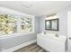 Bright bathroom with a double sink vanity, and grey plank flooring at 821 S Lebanon St, Lebanon, IN 46052