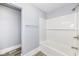 Bathroom featuring a white tiled shower, gray walls, and modern fixtures at 821 S Lebanon St, Lebanon, IN 46052