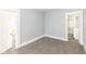 A cozy bedroom with neutral carpet and fresh paint provides a blank canvas for personalization at 821 S Lebanon St, Lebanon, IN 46052