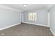A bedroom provides a serene setting with soft lighting and neutral carpet, ideal for peaceful nights and rejuvenation at 821 S Lebanon St, Lebanon, IN 46052